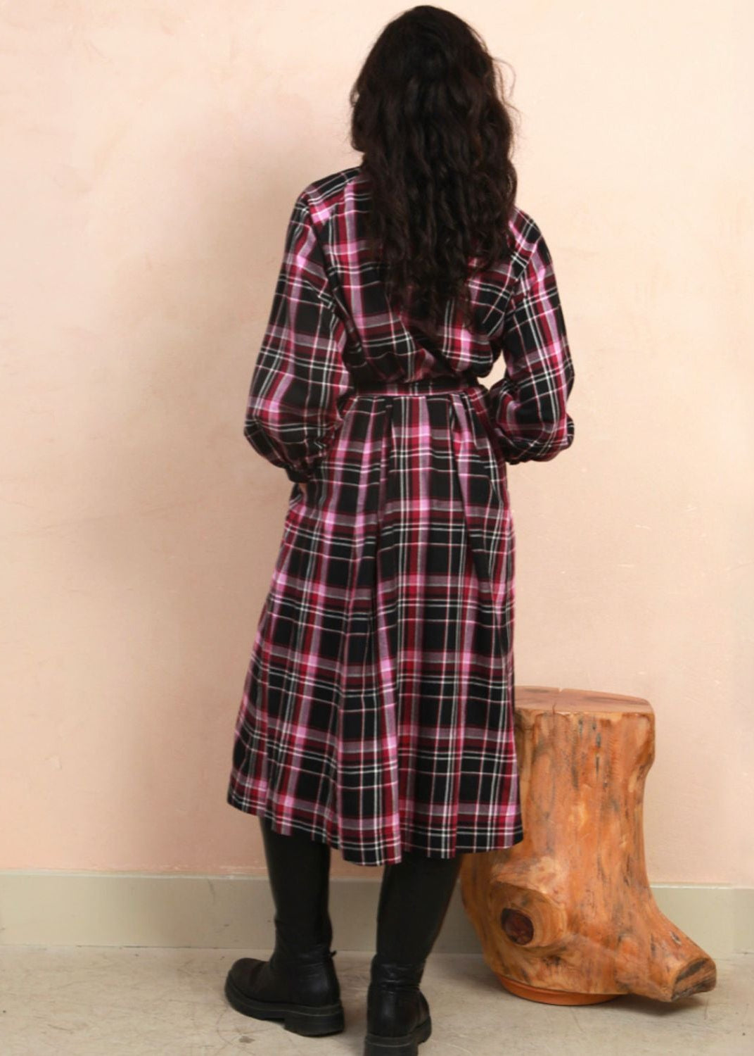 Back view of model wearing the berry and black check Amelia wrap midi dress showing fit and drape