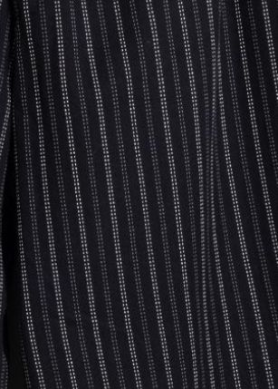 Close-up of a black fabric with thin vertical white dotted pinstripes.