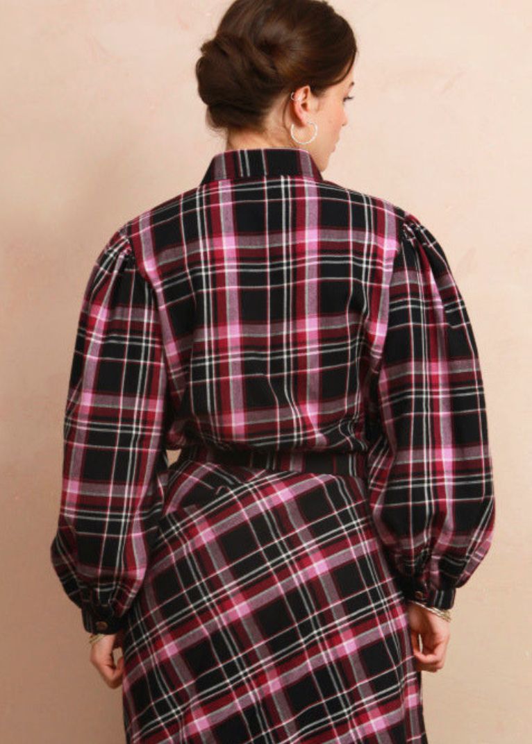 Back view of model wearing the berry and black check Effie Blouse