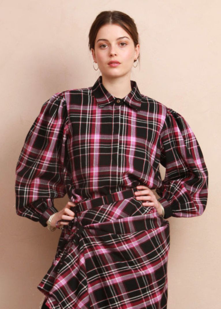 Model wearing the berry and black check Effie Blouse paired with matching Rebel Skirt