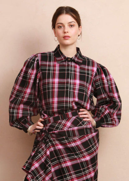 Model wearing the berry and black check Effie Blouse paired with matching Rebel Skirt