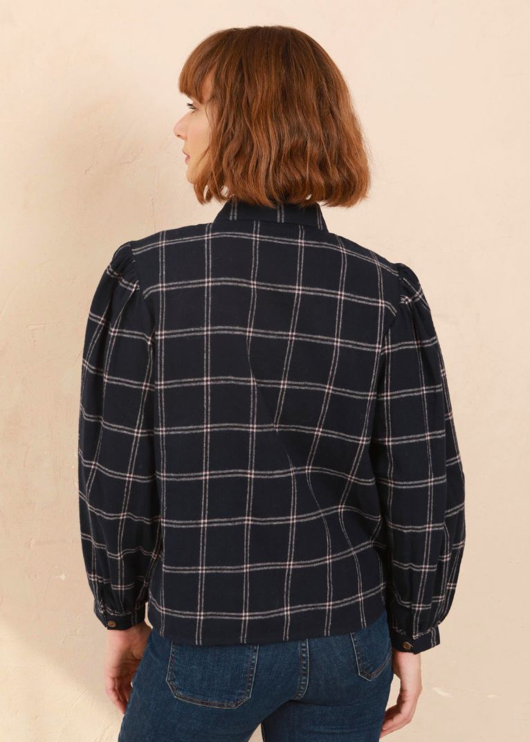 Model wearing the navy and pink Effie Blouse with volume sleeves, Back View