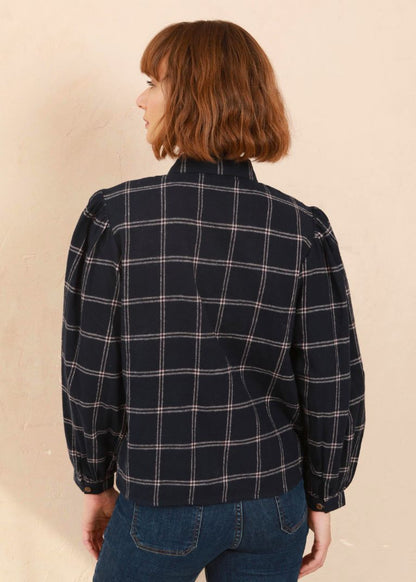 Model wearing the navy and pink Effie Blouse with volume sleeves, Back View