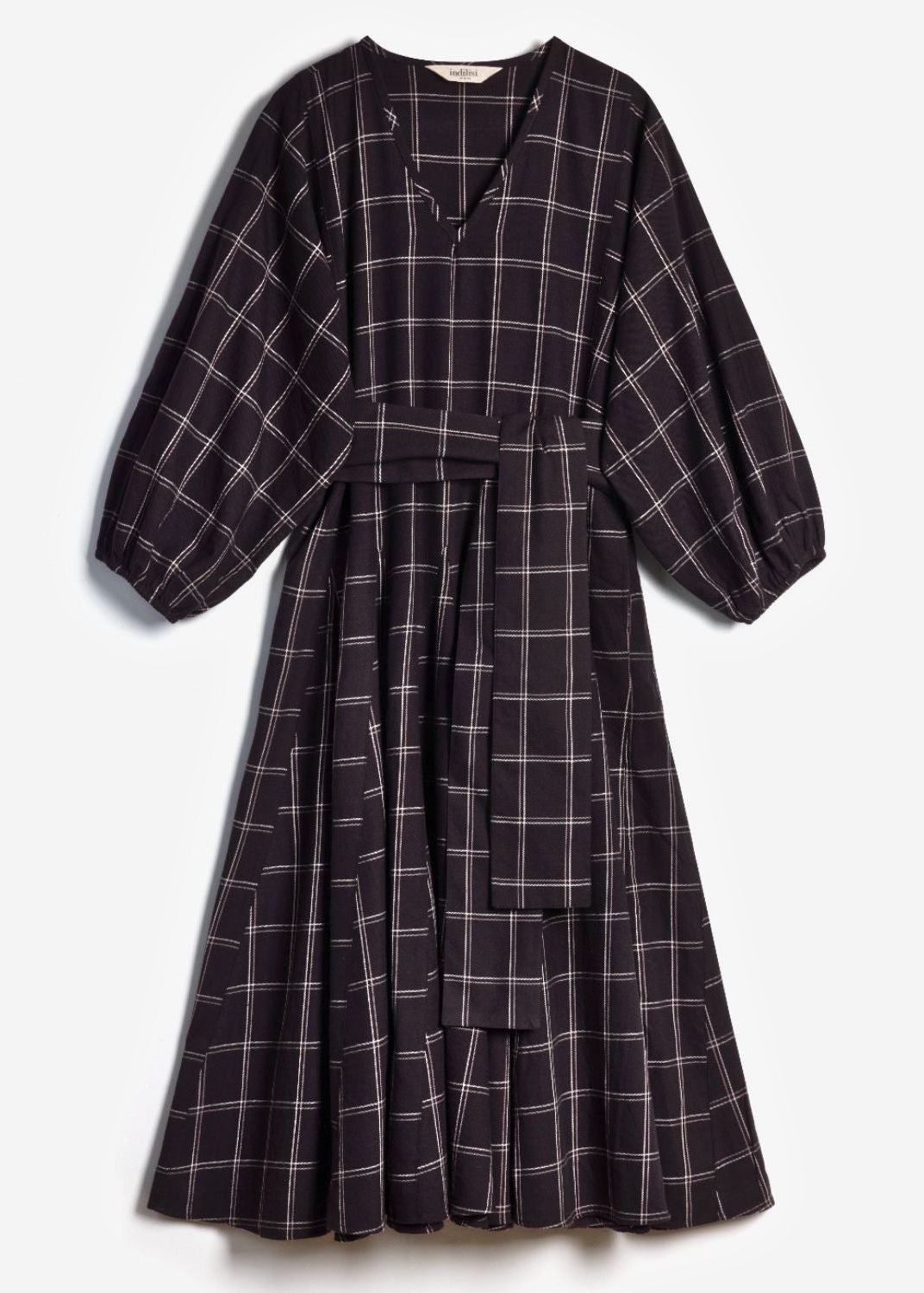 Flat lay product shot of the black and white check Penny Dress on a plain background