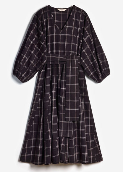 Flat lay product shot of the black and white check Penny Dress on a plain background