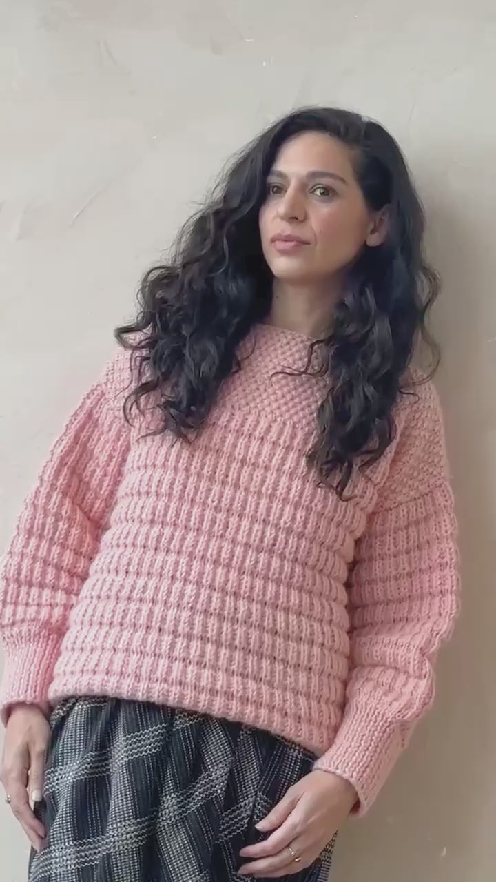 Model wearing the candyfloss pink boat neck sweater, editorial video