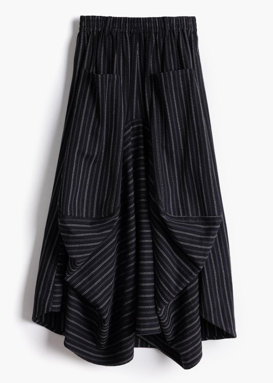 Studio product shot of the black stripe Safia Skirt showing asymmetrical draped hem and pinstripe pattern