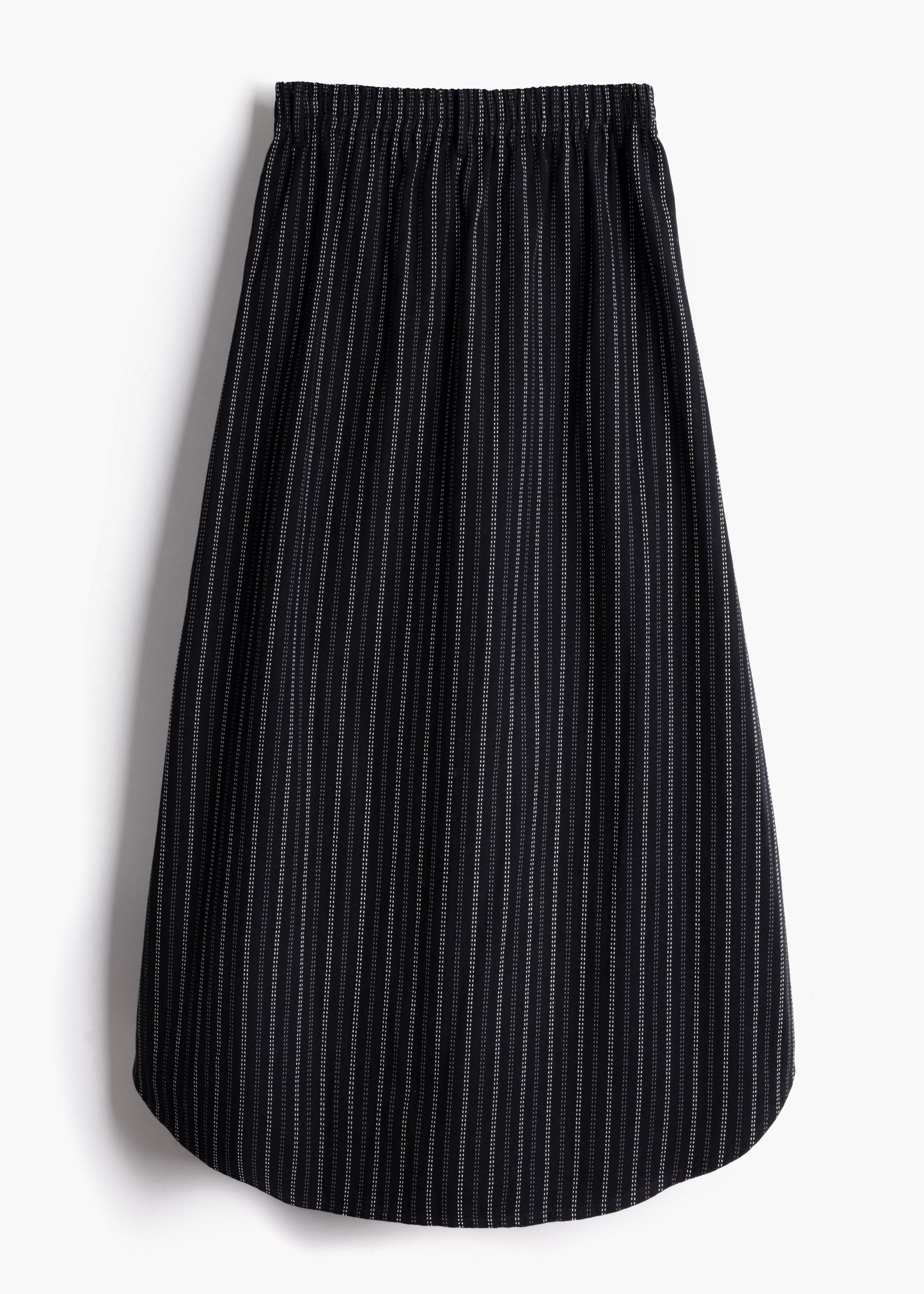 Studio product shot showing the back view and stretch waistband of the black stripe Safia Skirt