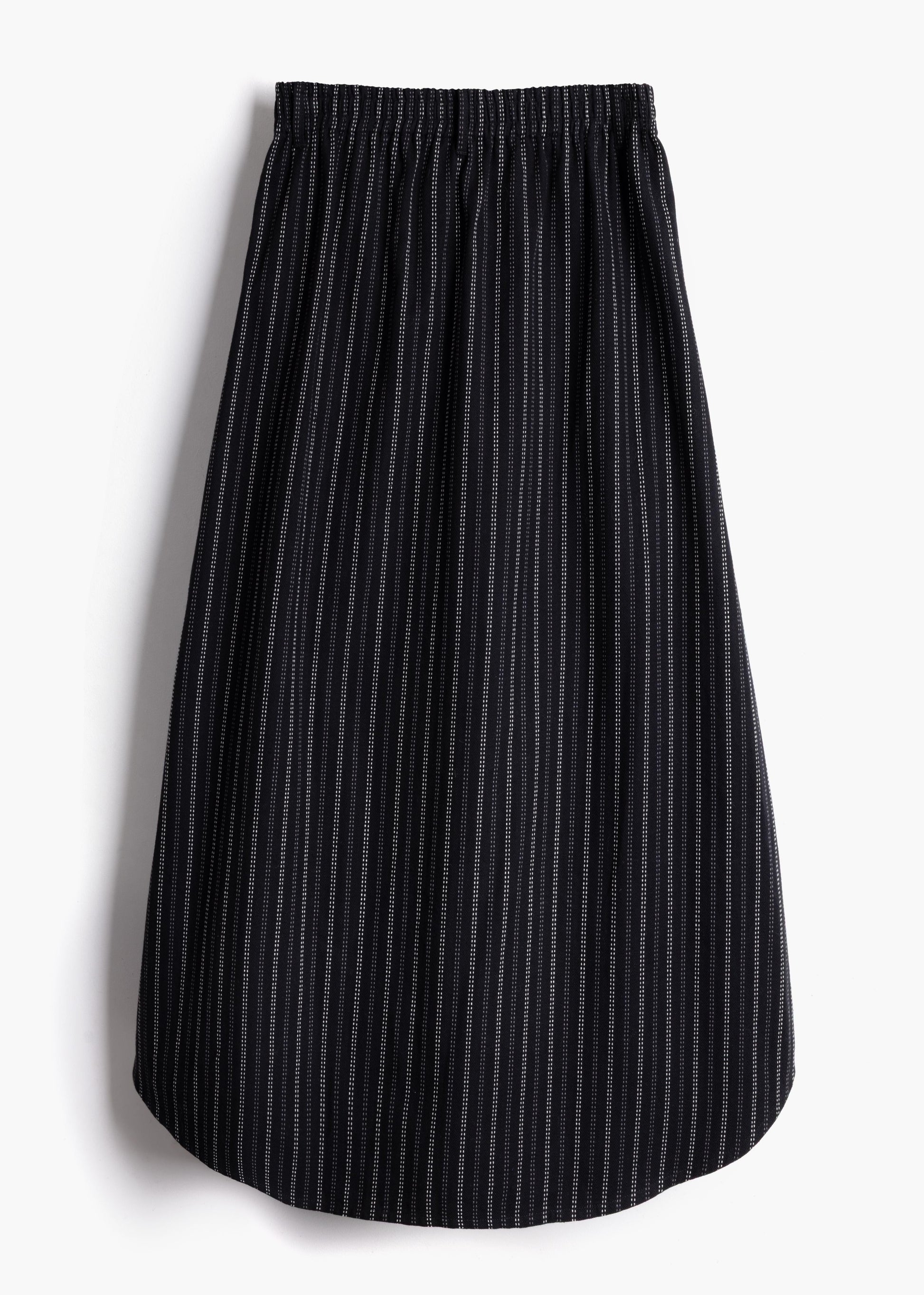 Studio product shot showing the back view and stretch waistband of the black stripe Safia Skirt