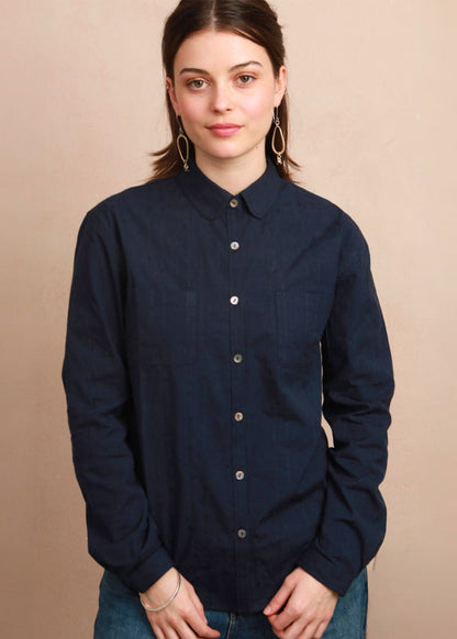 Straight front view of model wearing the dark navy button-down Sylvia Shirt