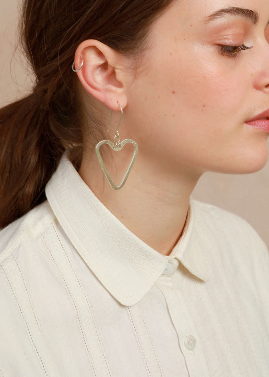 Close-up profile shot showing the soft rounded collar and delicate white lace texture on the Sylvia Shirt