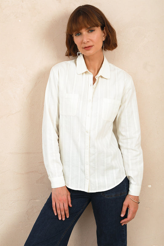 Model wearing the white lace Sylvia Shirt with soft rounded collar and front pockets
