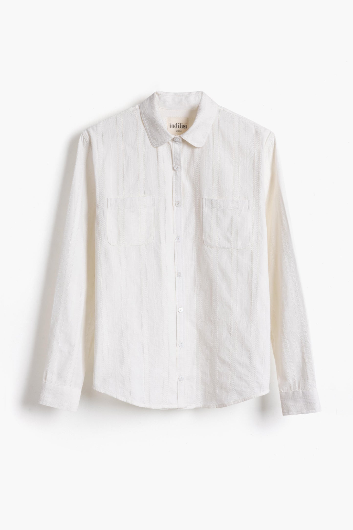 Studio product shot of the white lace Sylvia Shirt on a plain background