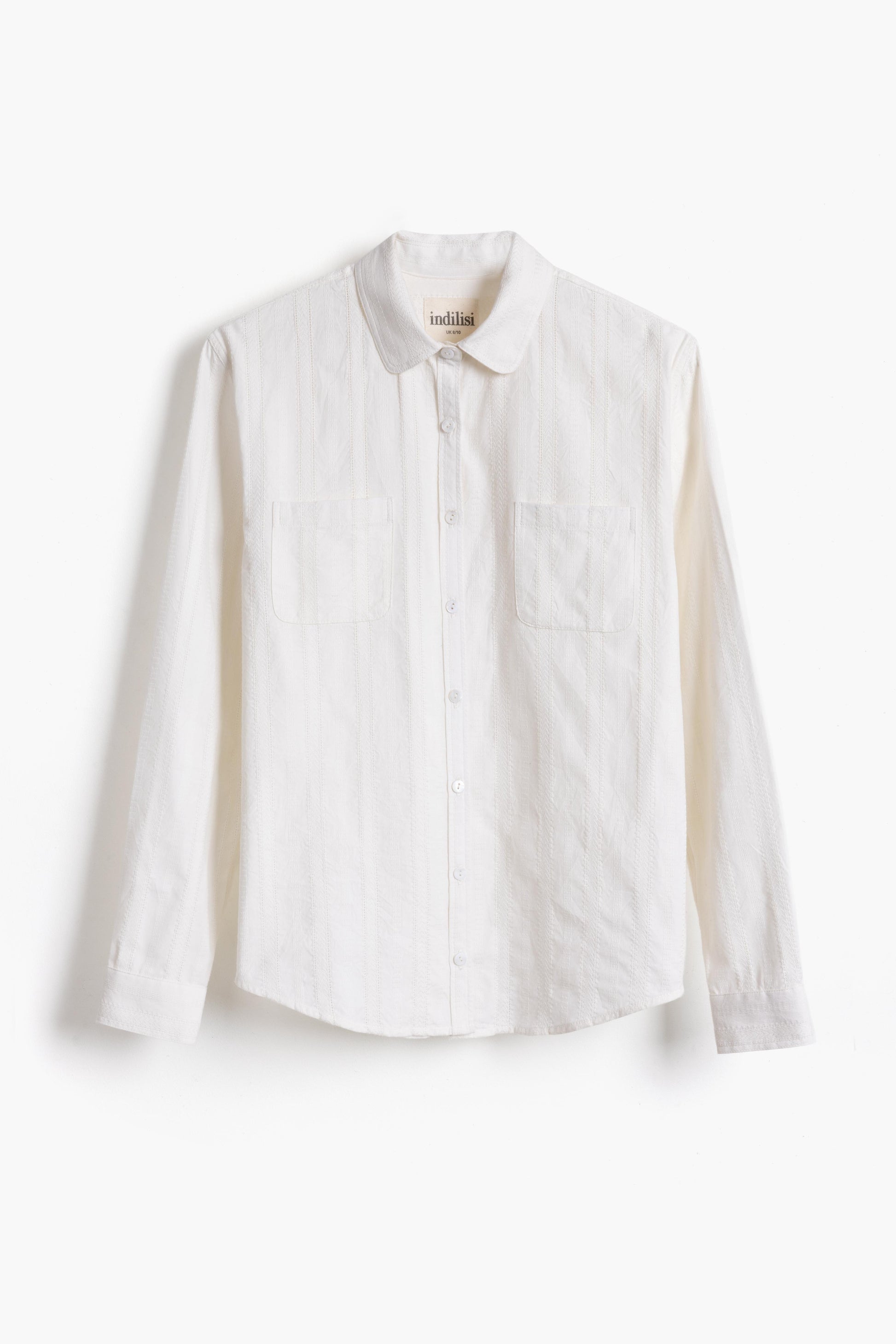 Studio product shot of the white lace Sylvia Shirt on a plain background