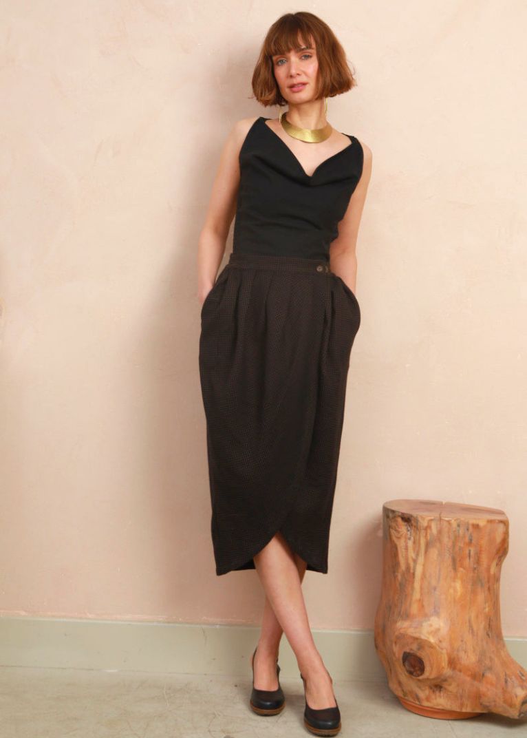 Full-length front view of model wearing the black and brown jacquard Venus Skirt