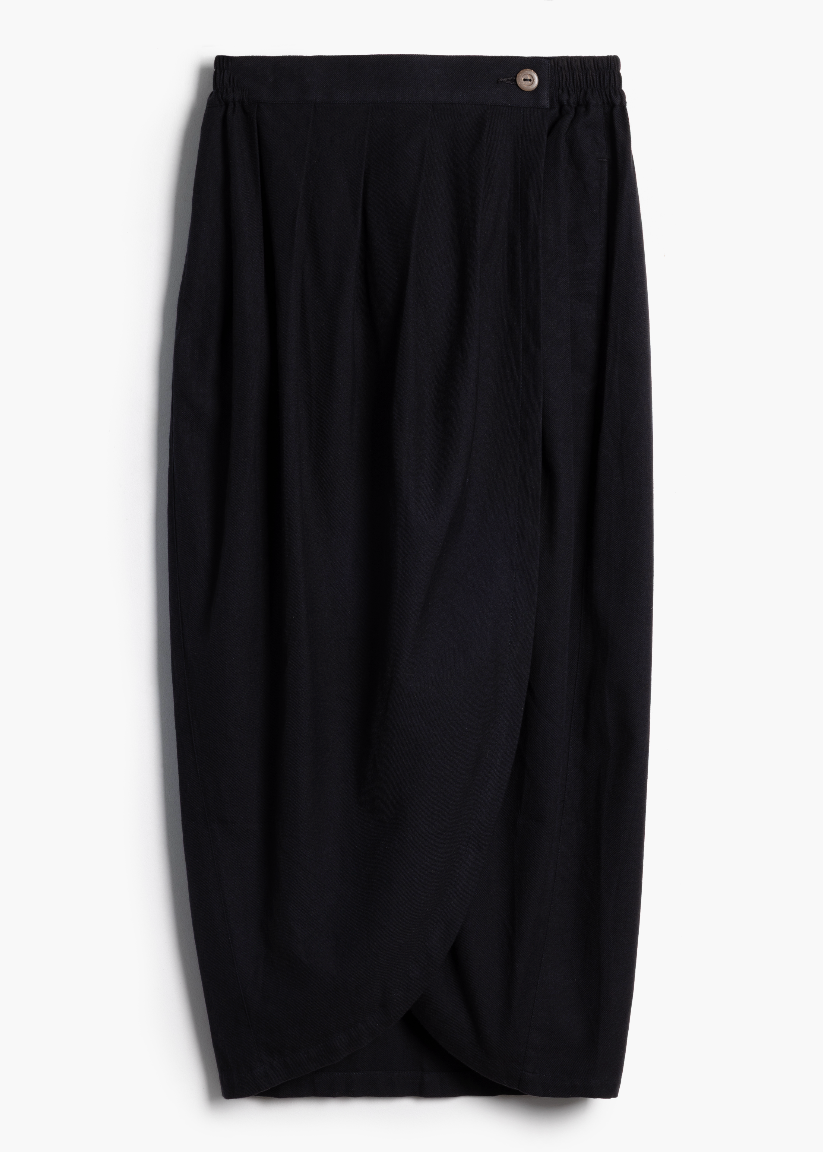 Studio product shot of the black handwoven Venus Skirt with asymmetric front seam