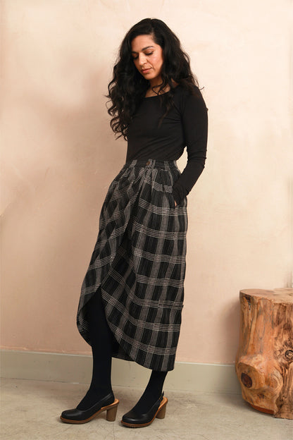 Close-up front view of the Venus Skirt showing the black and grey Nachnakhati stitch pattern and waist fit