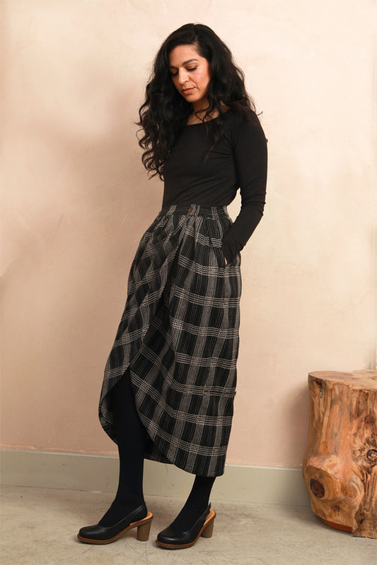 Close-up front view of the Venus Skirt showing the black and grey Nachnakhati stitch pattern and waist fit