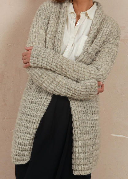 Model standing in the Waffle Longline Cardigan showing detail